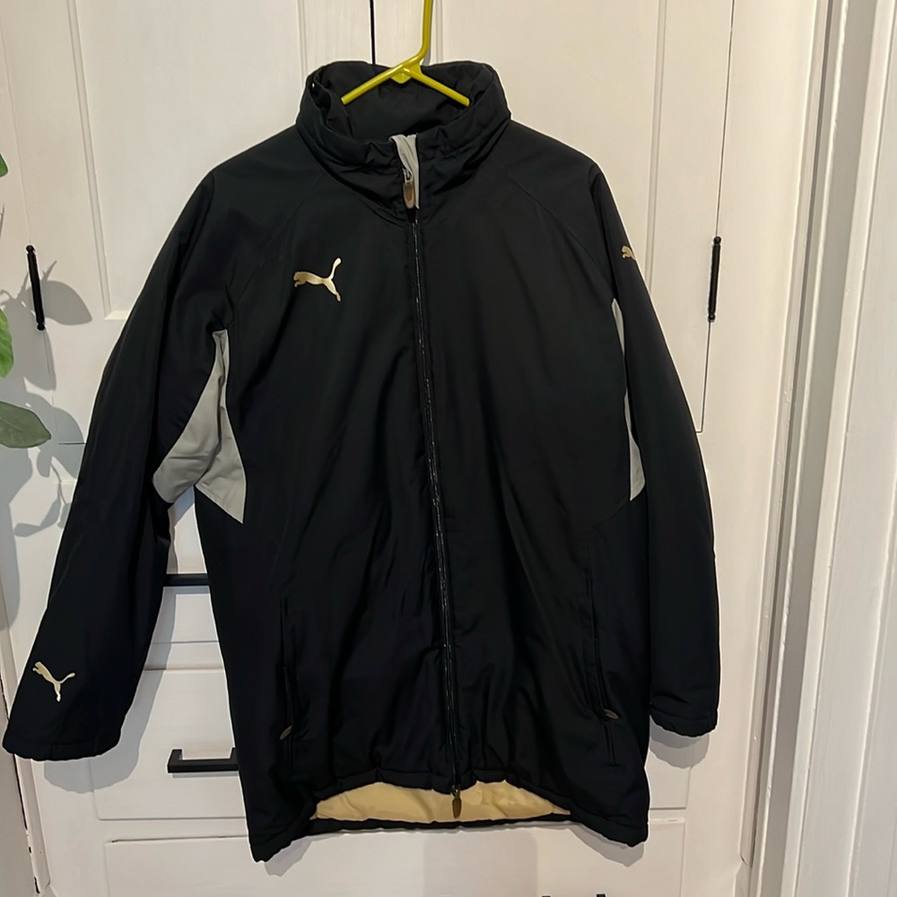 Puma mid length soccer jacket.